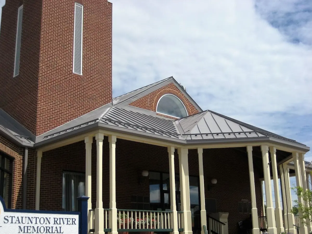 Skilled roofing craftsmen working on a residential roof in Verona
